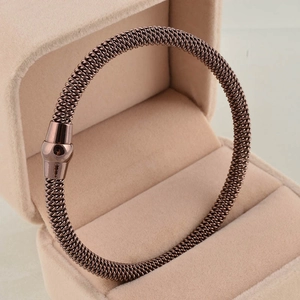 Rose gold braided mesh stainless steel cable bracelet with magnetic cylinder clasp