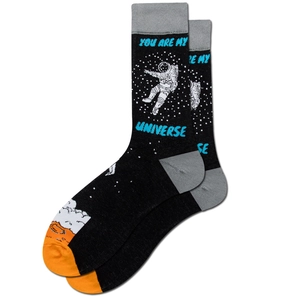 Detail of black crew socks featuring astronaut and beer motifs with blue typography
