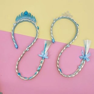 Detail of Elsa inspired hairbands featuring blue crown, glitter snowflake and long braids