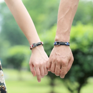 Braided leather guitar charm bracelets for couples featuring black and red woven cords