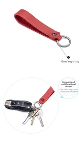 Detail view of red leather car keychain strap with silver stainless steel ring attachment