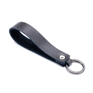 Classic black leather car keychain with a sturdy metal ring on a white background