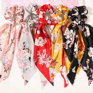Detailed set of five satin floral bow scrunchies in pink, red, yellow, grey and black