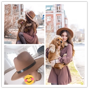 Detail of brown wool fedora hat featuring a black faux leather snakeskin belt accent