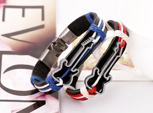 Detail view of woven leather bracelets with vintage bronze guitar charms in red and blue