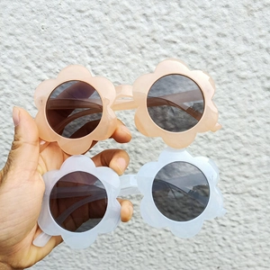 Cute sunflower shaped sunglasses for toddlers with round lenses in pink and blue colors