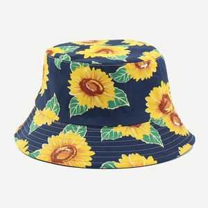 Reversible navy sunflower bucket hat with yellow floral print and wide sun shade brim