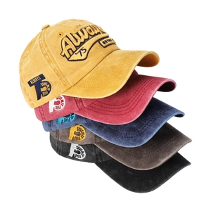 Close-up of vintage washed cotton baseball caps with 3D embroidery in five colors