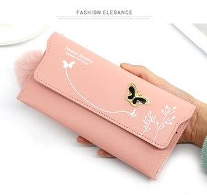 Detail of soft pink long wallet with black butterfly clasp and white floral prints