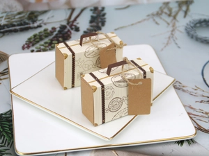 Macro detail of mini luggage candy boxes with vintage royal postal service print