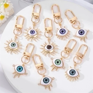 Alloy Sun Evil Eye Keychain With Rhinestones And Resin Patch Gold Plated Devil Eye Bag Charm Pendant For Women Jewelry Gift