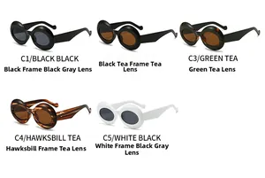 Flat lay display of oval retro sunglasses in black, tea, tortoise, and white frames