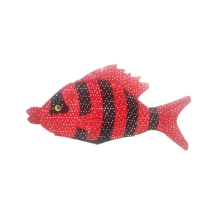 Close-up of red clown shoe fabric with white polka dots and black stripe details