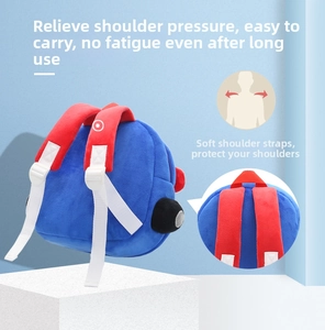 Detail of soft padded red shoulder straps on a blue car-shaped plush backpack for kids