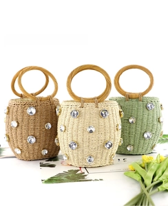 Straw bucket bags in three colors featuring sparkling rhinestone embellishments