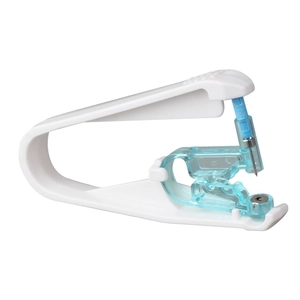 Disposable ear piercing gun with white plastic frame and built-in sterile metal stud