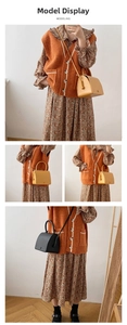 Detail showing retro leather crossbody bags in yellow and black with sleek curved silhouette