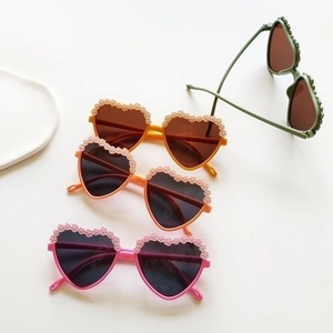 Fashion heart-shaped kids sunglasses with embossed floral frames in multiple colors