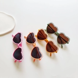 Modern heart-shaped kids sunglasses with floral frame in four pastel colors