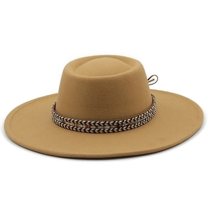 Detail of khaki flat top wool felt hat with ethnic woven band and brown cord trim