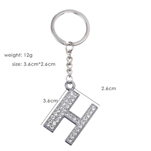 Detail of silver letter H keychain with sparkling rhinestones and product measurements