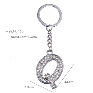 Silver letter Q keychain with sparkling crystals showing weight 15g and size 3.3x3.6cm