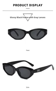 Macro detail of cat-eye sunglasses with glossy black frames and metal logo hinges