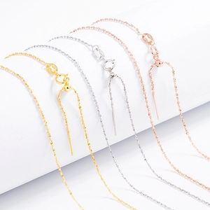 Macro view of adjustable S925 sterling silver chains in gold, silver, and rose gold