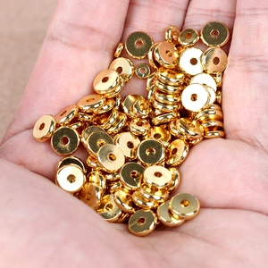 Flat circular copper spacer beads in bright gold finish for DIY jewelry and bracelets