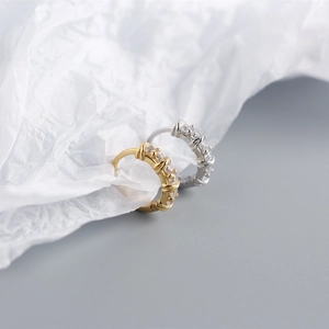 Detailed view of gold and silver S925 sterling silver hoop earrings with zircon stones