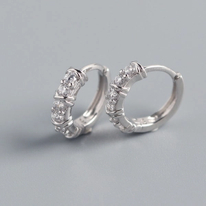 Close-up of S925 sterling silver hoop earrings with shimmering cubic zirconia stones