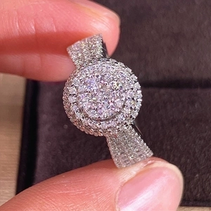 Elegant silver cluster diamond ring with double halo and pave band on a dark gift box