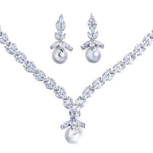 Elegant bridal jewelry set with marquise zircon and pearls on silver necklace and earrings
