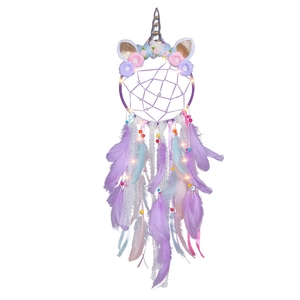 Luminous unicorn dream catcher with purple feathers, silk ribbons and floral accents