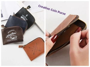 Black and brown leather coin purses with zipper closure and embossed adventurer design
