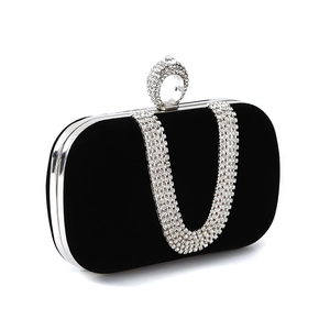 Elegant black velvet evening clutch with U-shaped crystal chain and rhinestone ring handle