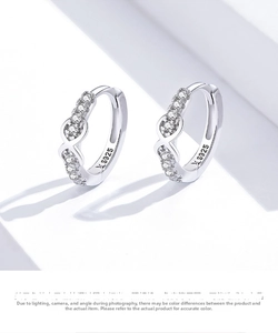 Close-up of S925 sterling silver hoop earrings with sparkling cubic zirconia inlay