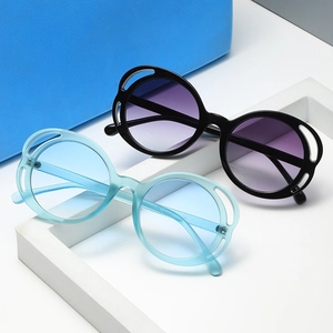 Chic round frame sunglasses with hollow patterned rims and stylish gradient lenses