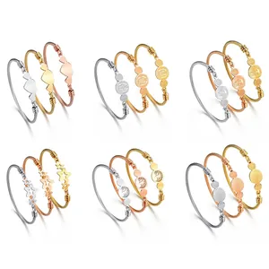 Three-piece stainless steel cable wire bangles with tree of life and heart charms