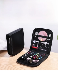 Portable 10-piece sewing kit with thread, scissors, and tools in a black zipper case