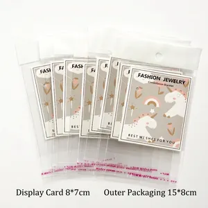 Detailed view of OPP adhesive bag with 8x7cm unicorn printed card for jewelry packing