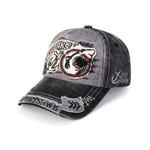 Detail of washed cotton baseball cap featuring shark patch and anchor embroidery