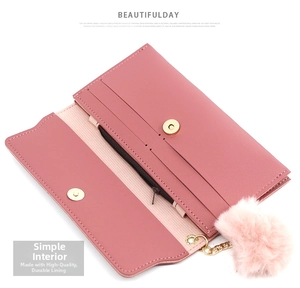Detail view of pink long wallet interior with multi-card slots and zippered pocket