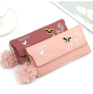 Close-up of women long leather wallets with butterfly metal buckle and floral print