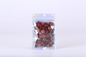 Holographic laser ziplock bag filled with dried rose buds on a white background