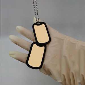 Golden stainless steel double military dog tags with black silicone silencers and ball chain