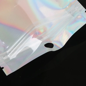 Detail of holographic resealable pouch with zipper seal and round hanging hole