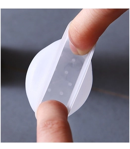Close-up of a soft translucent silicone chair leg protector showing flexible texture