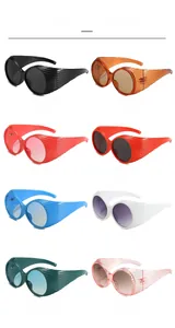 Matrix of round oversized sunglasses with wide textured temples in eight vibrant colors