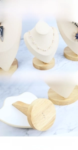 Detail of natural beech wood base and soft velvet surface on jewelry display stands